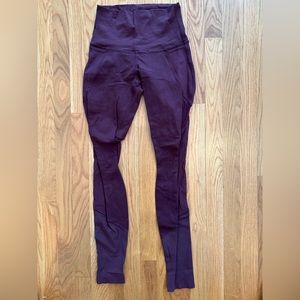 Lululemon maroon yoga pants with mesh siding, size 4